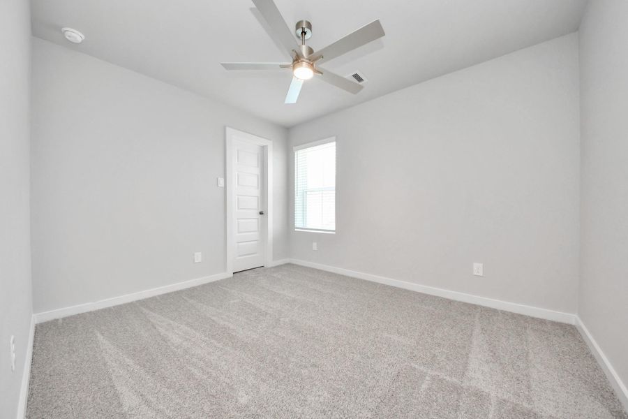 Generously sized secondary bedrooms featuring spacious closets, soft and inviting carpeting underfoot, large windows allowing plenty of natural light, and the added touch of privacy blinds for your personal retreat. Sample photo of completed home with similar floor plan. Actual colors and selections may vary. Generously sized secondary bedrooms featuring spacious closets, soft and inviting carpeting underfoot, large windows allowing plenty of natural light, and the added touch of privacy blinds for your personal retreat. Sample photo of completed home with similar floor plan. Actual colors and selections may vary.