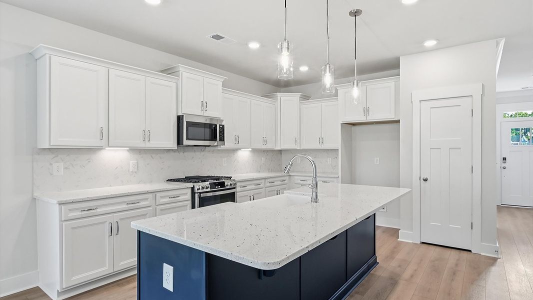 Accomplished layout with a stunning 9-foot island, pendant lighting, and superior craftsmanship at Creeks at Midway