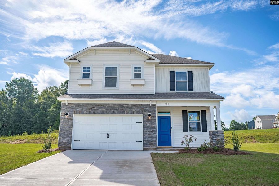Front exterior of a new home in Old Charleston Estates, Pelion, SC, highlighting curb appeal (Image 1). Front exterior of a new home in Old Charleston Estates, Pelion, SC, highlighting curb appeal (Image 1).