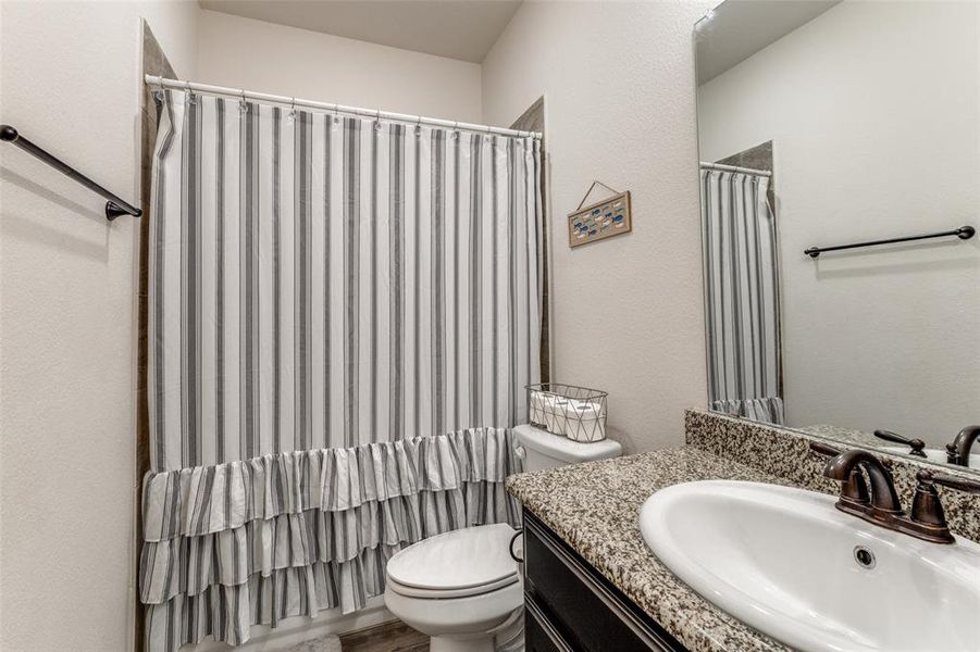 Bathroom with vanity and toilet