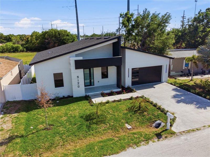 Front exterior of a new home in , Pinellas Park, FL, highlighting curb appeal (Image 29).