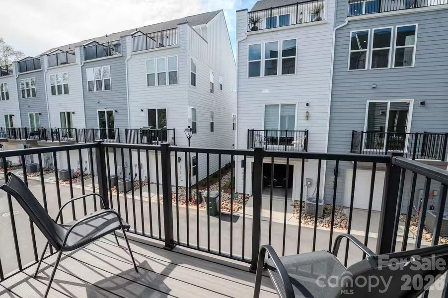Step outside to a private balcony, the perfect spot to enjoy your morning coffee, unwind in the evening, or take in the surrounding neighborhood views. Step outside to a private balcony, the perfect spot to enjoy your morning coffee, unwind in the evening, or take in the surrounding neighborhood views.
