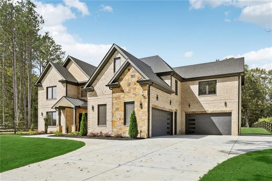 Front exterior of a new home in , Lawrenceville, GA, highlighting curb appeal (Image 2).