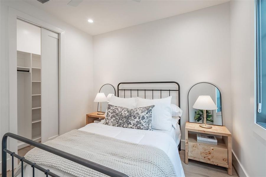 Bedroom featuring a closet and light hardwood / wood-style flooring