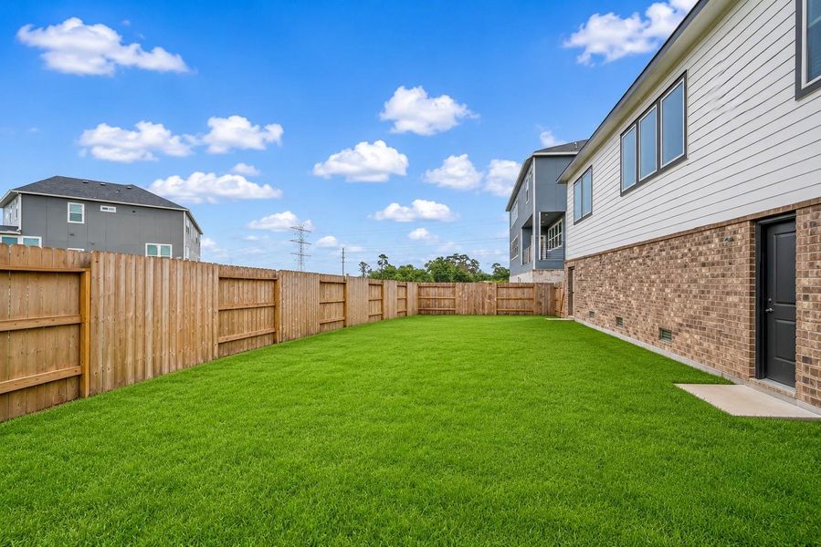 Spacious fenced backyard. Spacious fenced backyard.