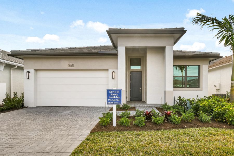 Front exterior of a new home in PGA Village Verano, Port St. Lucie, FL, highlighting curb appeal (Image 9).