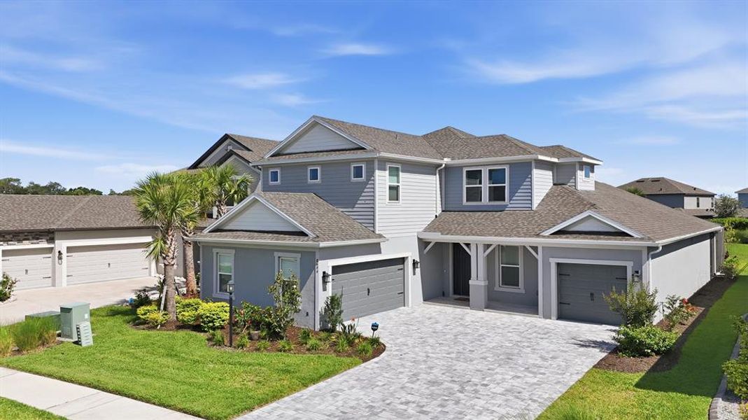 Front exterior of a new home in , Sarasota, FL, highlighting curb appeal (Image 2). Front exterior of a new home in , Sarasota, FL, highlighting curb appeal (Image 2).