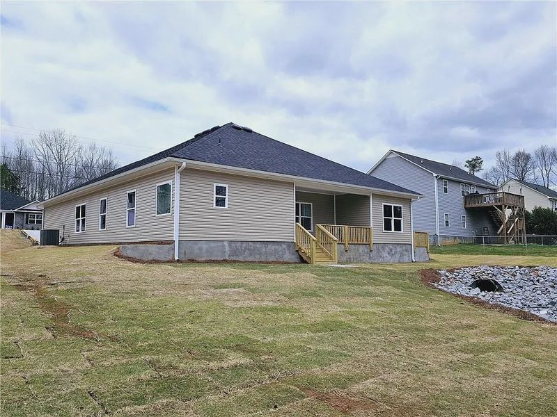 Front exterior of a new home in Scarlett Place, Bowdon, GA, highlighting curb appeal (Image 2).