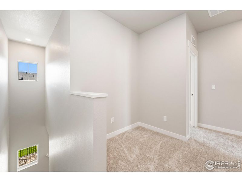 Spacious, unfurnished interior of a new home in The Lakes at Centerra - Discovery, Loveland (Image 18).