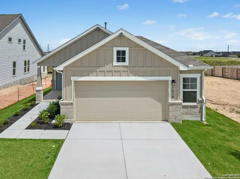 Front exterior of a new home in Willowbrook, New Braunfels, TX, highlighting curb appeal (Image 1).