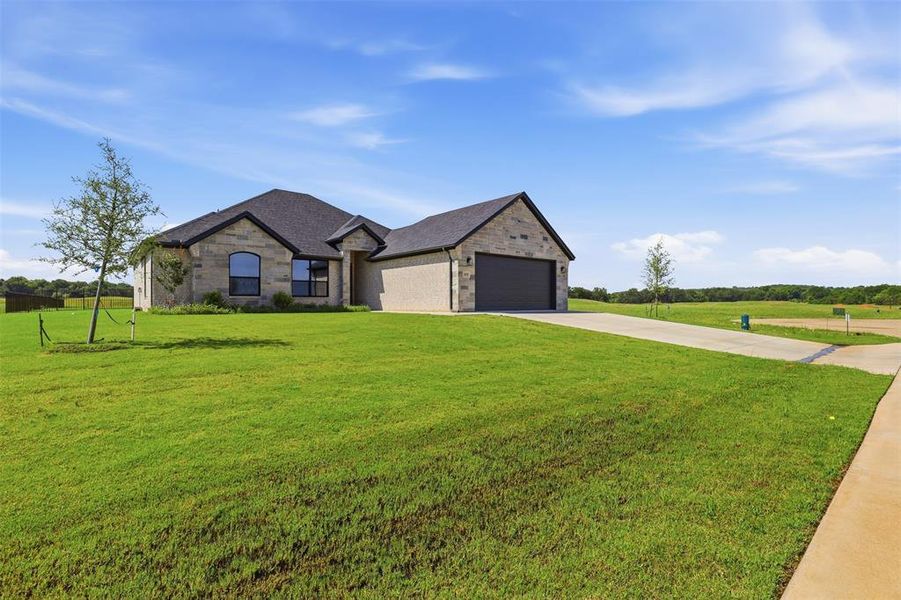 Front exterior of a new home in , Glen Rose, TX, highlighting curb appeal (Image 22). Front exterior of a new home in , Glen Rose, TX, highlighting curb appeal (Image 22).