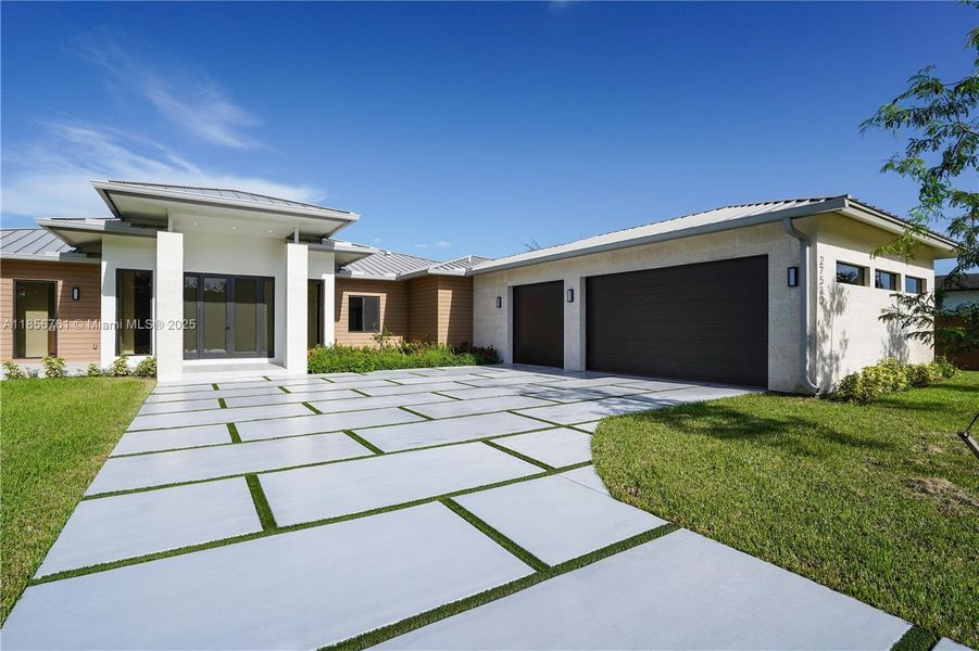 Front exterior of a new home in , Homestead, FL, highlighting curb appeal (Image 32).