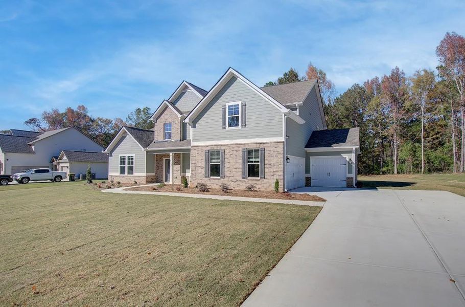 Front exterior of a new home in Saddleridge, Senoia, GA, highlighting curb appeal (Image 17).