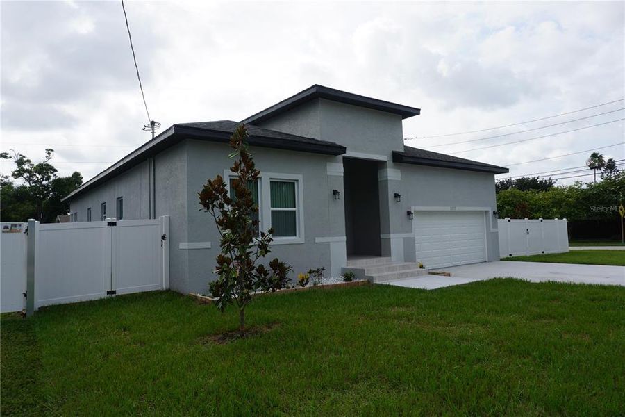 Front exterior of a new home in , Largo, FL, highlighting curb appeal (Image 17). Front exterior of a new home in , Largo, FL, highlighting curb appeal (Image 17).
