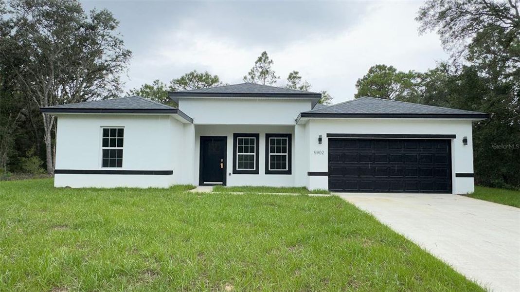 Front exterior of a new home in , Citrus Springs, FL, highlighting curb appeal (Image 20).