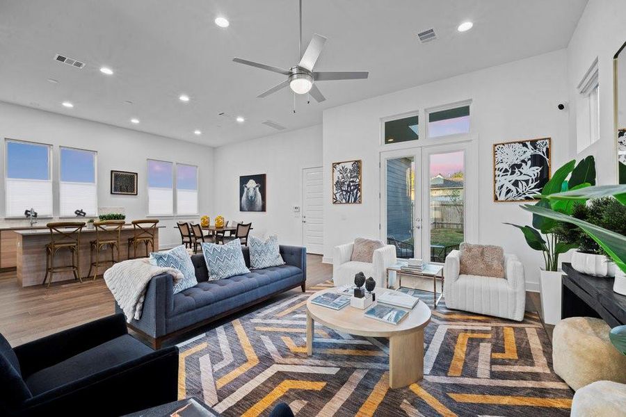 Living room featuring recessed lighting, wood finished floors, and a ceiling fan