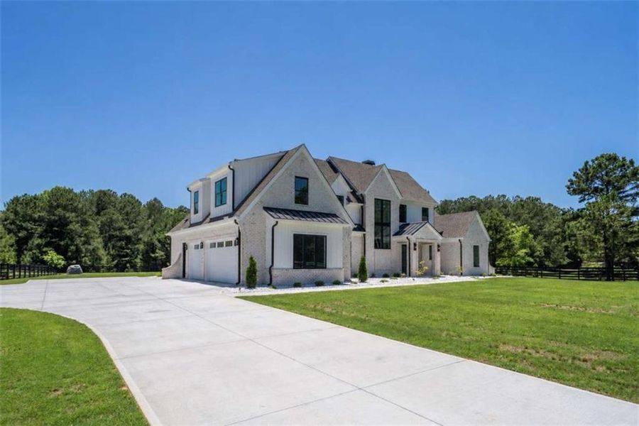 Front exterior of a new home in , Monroe, GA, highlighting curb appeal (Image 27). Front exterior of a new home in , Monroe, GA, highlighting curb appeal (Image 27).