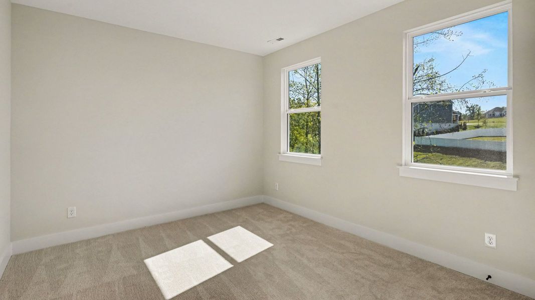 Secondary bedroom with windows and closet Secondary bedroom with windows and closet