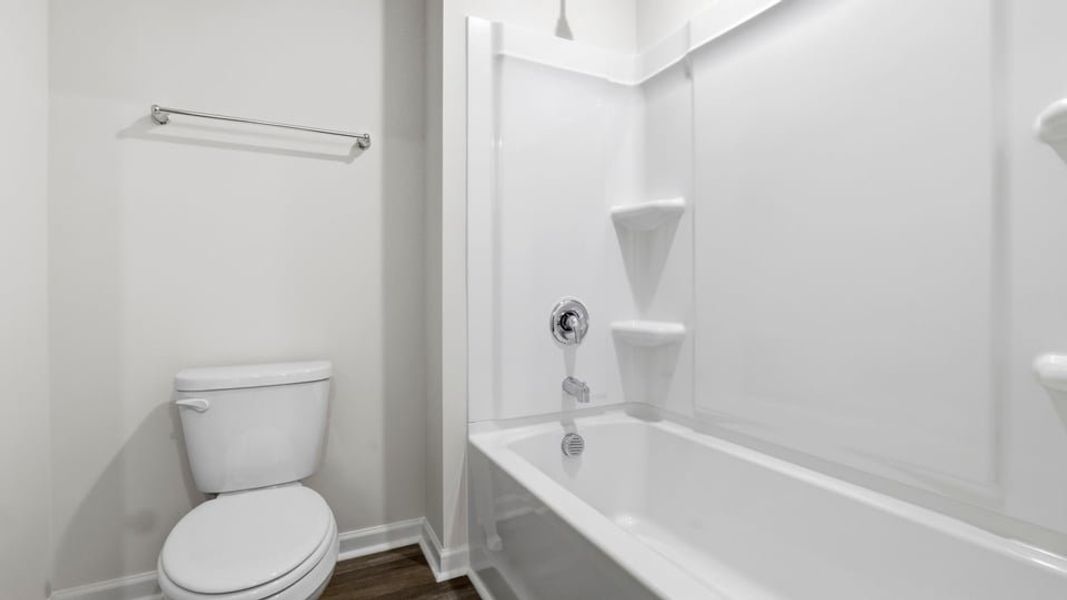 Furnished interior view inside a new home in Bentley Park, Greenwood (Image 8).