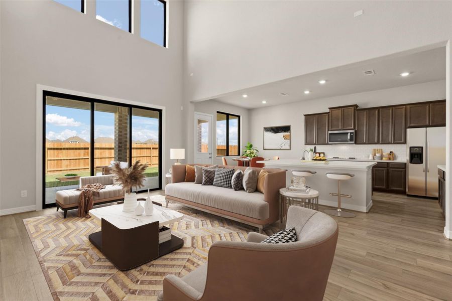 Two story ceilings open concept living/kitchen.  representative photo.