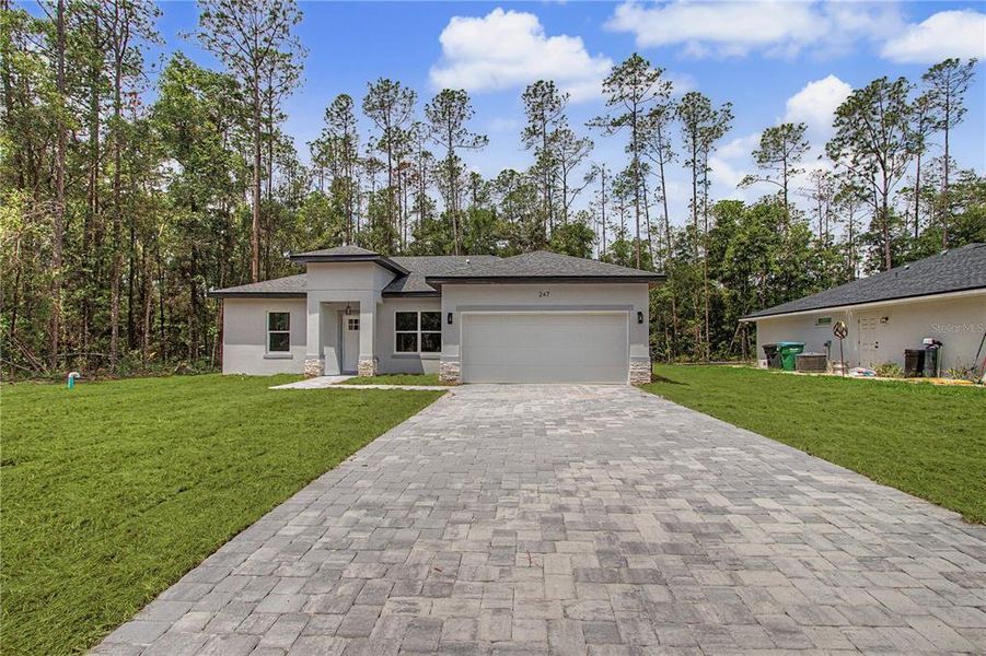Front exterior of a new home in , Citrus Springs, FL, highlighting curb appeal (Image 20). Front exterior of a new home in , Citrus Springs, FL, highlighting curb appeal (Image 20).