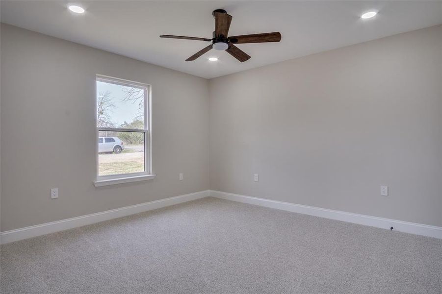 Unfurnished room featuring recessed lighting, baseboards, and carpet