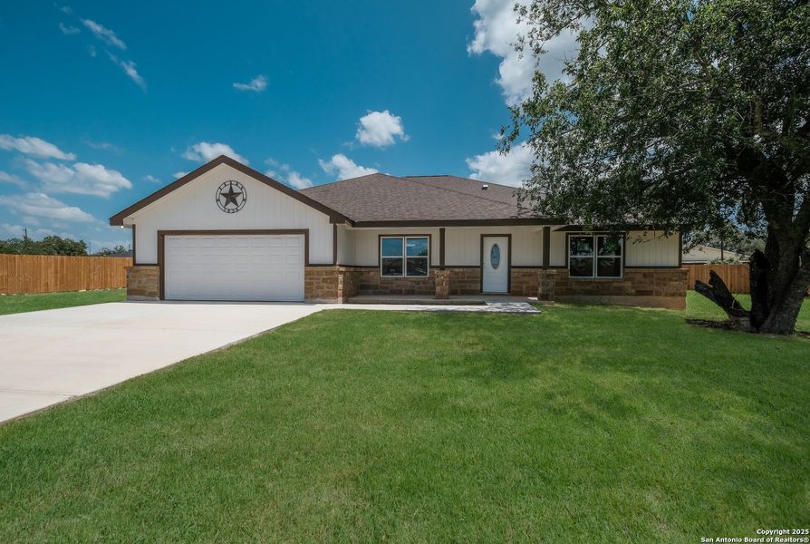 Front exterior of a new home in , Castroville, TX, highlighting curb appeal (Image 2). Front exterior of a new home in , Castroville, TX, highlighting curb appeal (Image 2).