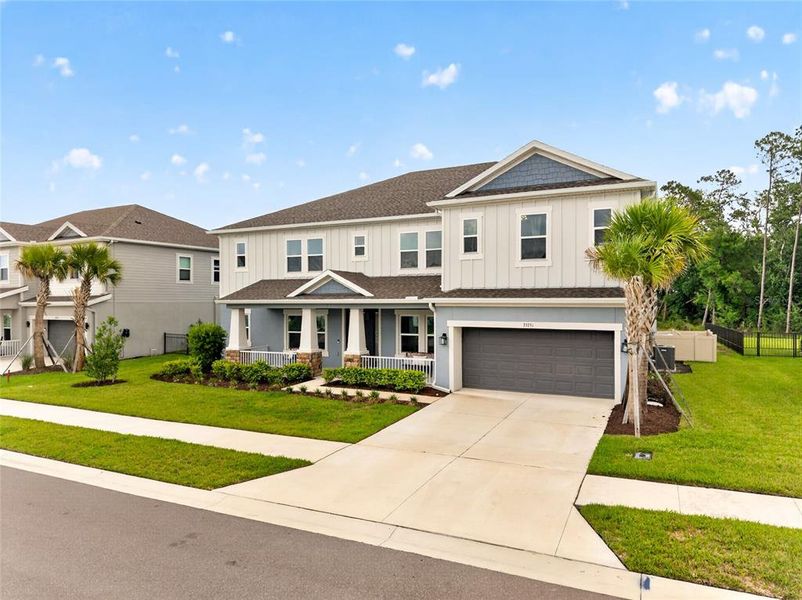 Front exterior of a new home in , Wesley Chapel, FL, highlighting curb appeal (Image 22). Front exterior of a new home in , Wesley Chapel, FL, highlighting curb appeal (Image 22).