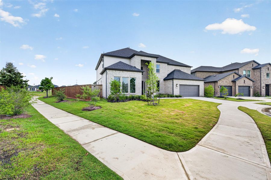 Front exterior of a new home in , Cypress, TX, highlighting curb appeal (Image 25). Front exterior of a new home in , Cypress, TX, highlighting curb appeal (Image 25).