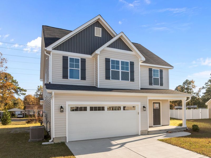 Front exterior of a new home in Arbor Hills South, Greenville, NC, highlighting curb appeal (Image 2). Front exterior of a new home in Arbor Hills South, Greenville, NC, highlighting curb appeal (Image 2).