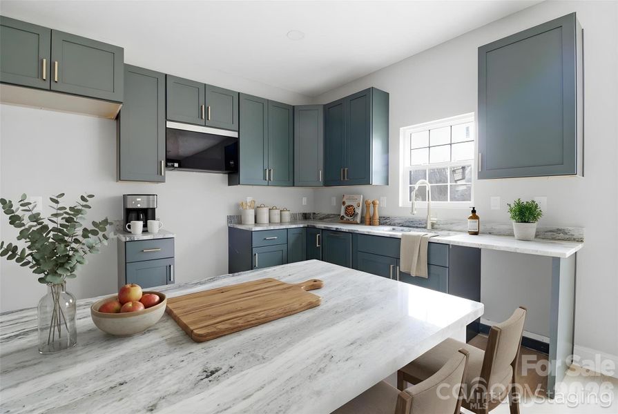 Up close shot of modern kitchen, w/ new counters, contemporary cabinetry, and sleek hardware (virtually staged/enhanced).