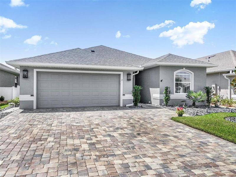 Front exterior of a new home in , Palm Coast, FL, highlighting curb appeal (Image 25).