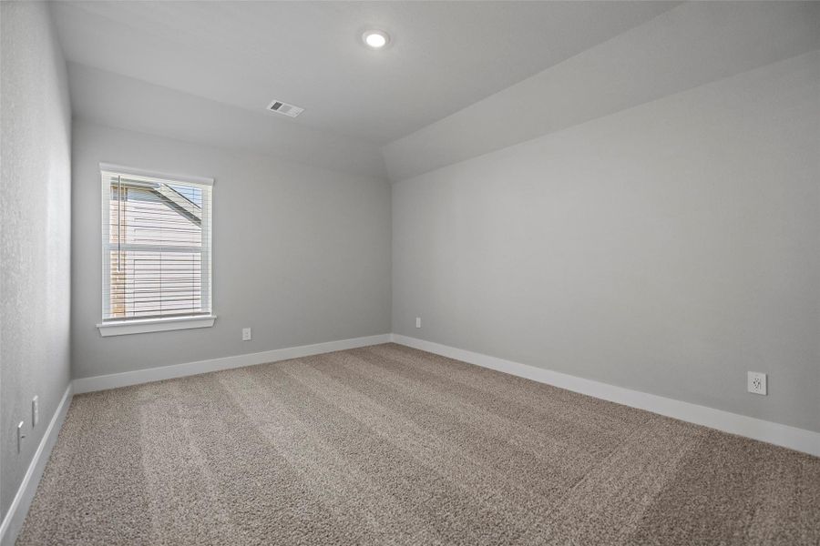 Spacious secondary bedrooms with plush carpet and ample closet space.