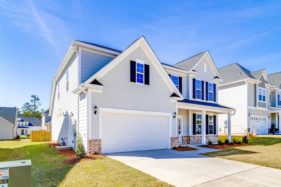 Front exterior of a new home in Pebble Branch, Chapin, SC, highlighting curb appeal (Image 21).
