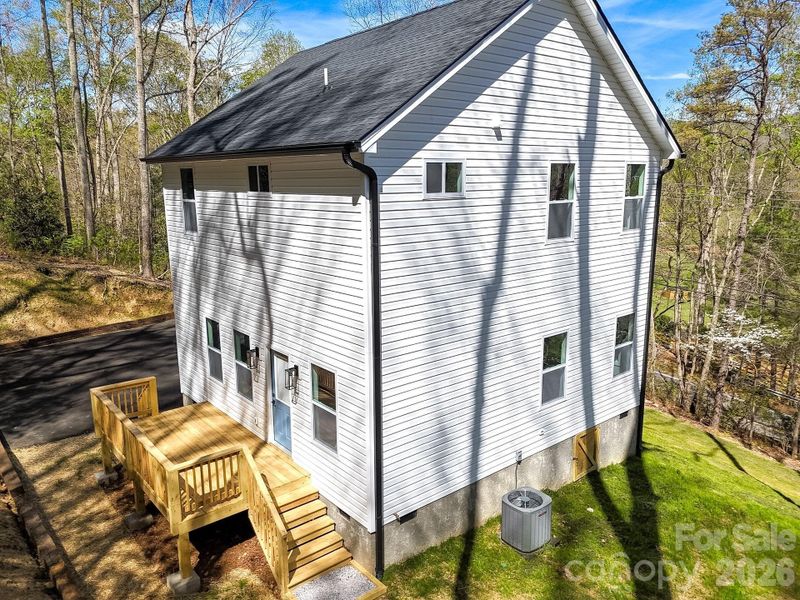 Exterior details and patio area of a home in , Fairview (Image 24).