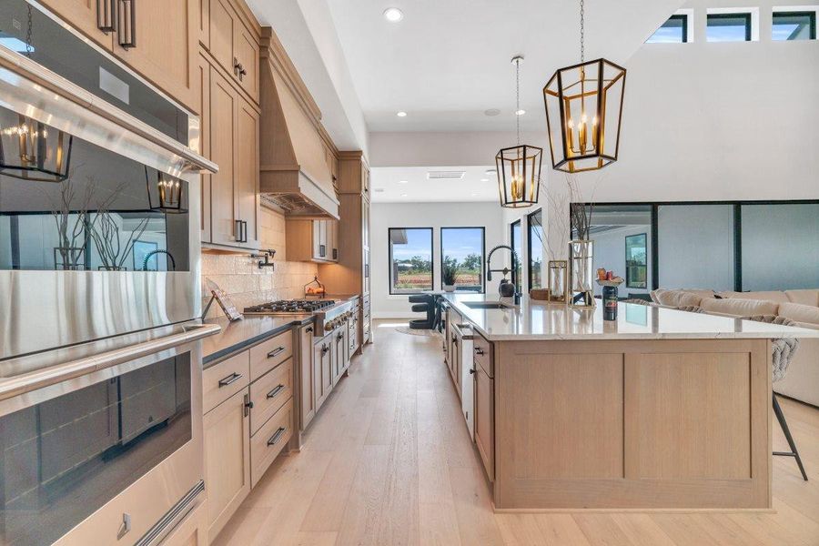 Chef's kitchen featuring high-end appliances Chef's kitchen featuring high-end appliances