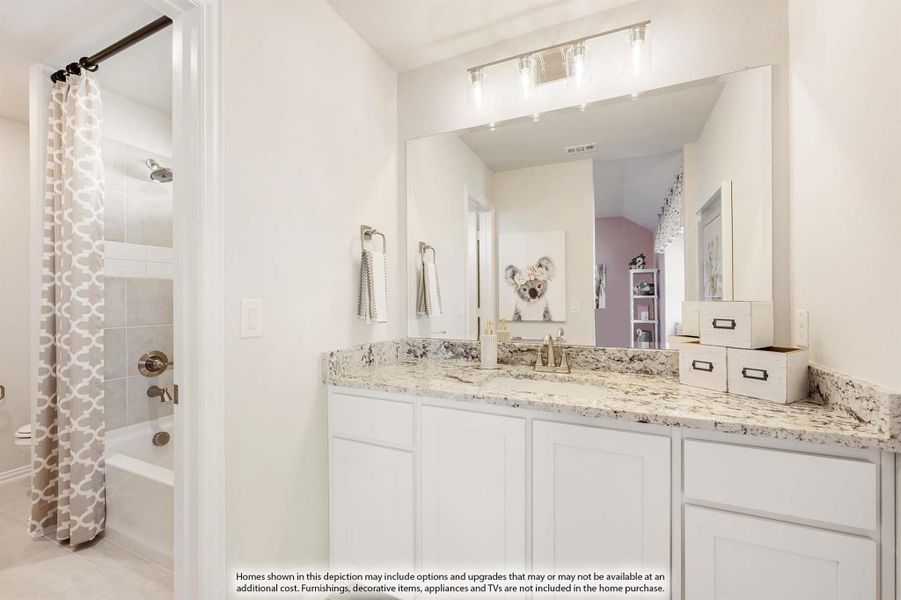 Bathroom with white cabinets, granite countertop, large mirror, and separate tub-shower combo with curtain. Bathroom with white cabinets, granite countertop, large mirror, and separate tub-shower combo with curtain.