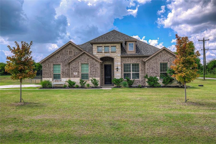 Front exterior of a new home in , Lone Oak, TX, highlighting curb appeal (Image 1). Front exterior of a new home in , Lone Oak, TX, highlighting curb appeal (Image 1).