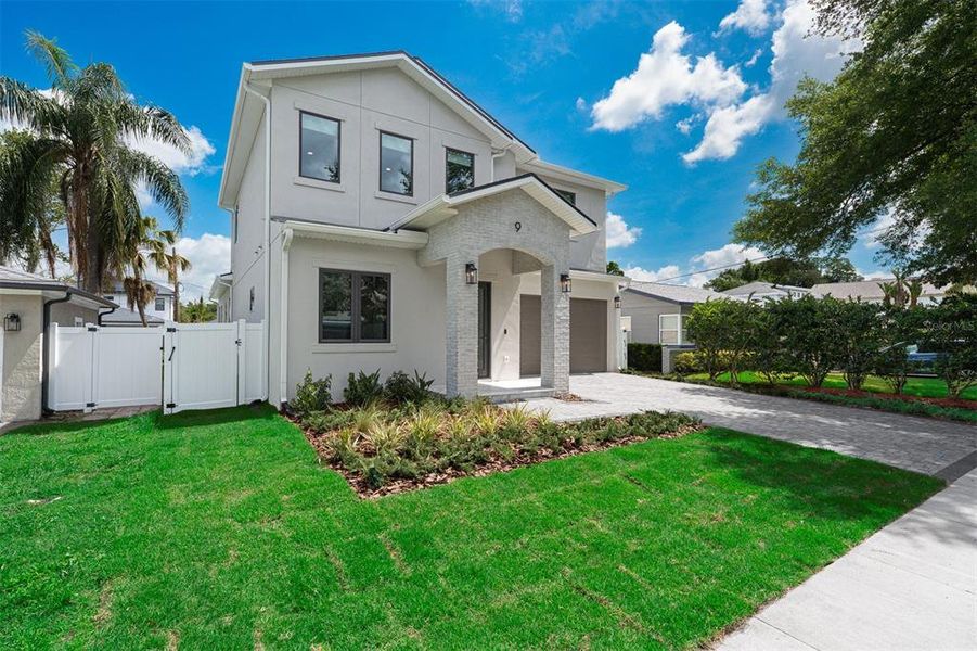 Front exterior of a new home in , Orlando, FL, highlighting curb appeal (Image 26).
