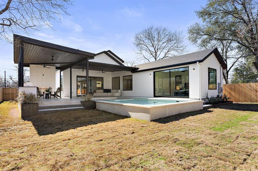 Rear view of home, pool and outdoor living