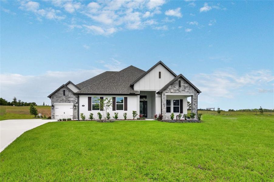 Front exterior of a new home in , Fruitland Park, FL, highlighting curb appeal (Image 30).