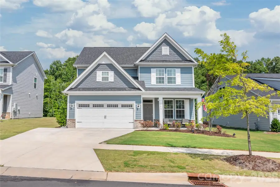 Front exterior of a new home in Medlin Forest, Monroe, NC, highlighting curb appeal (Image 1). Front exterior of a new home in Medlin Forest, Monroe, NC, highlighting curb appeal (Image 1).