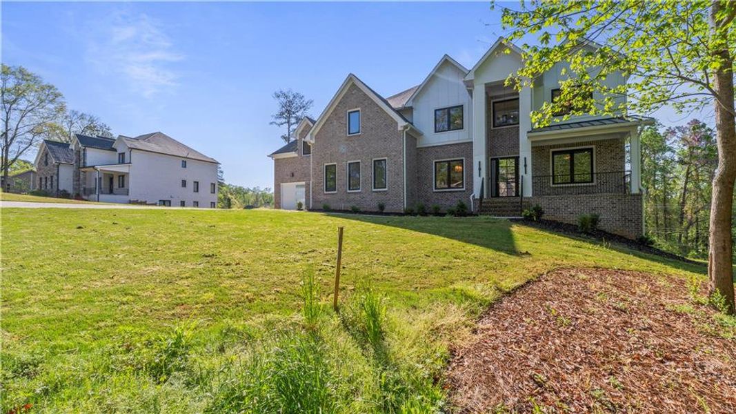Front exterior of a new home in , Marietta, GA, highlighting curb appeal (Image 23). Front exterior of a new home in , Marietta, GA, highlighting curb appeal (Image 23).