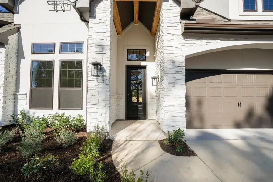 Exterior details and patio area of a home in The Woodlands Hills, Willis (Image 3).