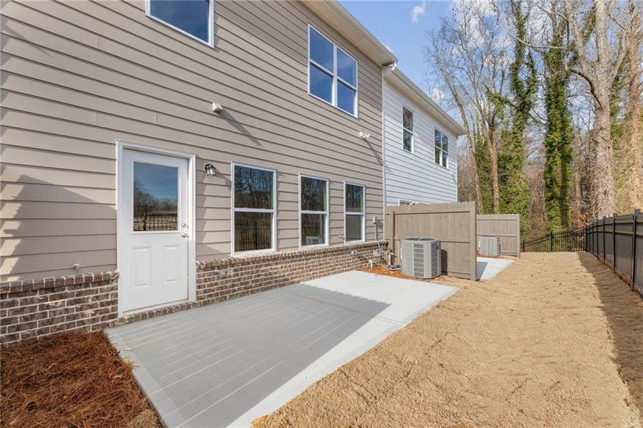 Exterior details and patio area of a home in River Walk Place, Lawrenceville (Image 16).