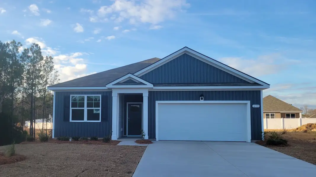 Front exterior of a new home in Heritage Crossing, Conway, SC, highlighting curb appeal (Image 1). Front exterior of a new home in Heritage Crossing, Conway, SC, highlighting curb appeal (Image 1).