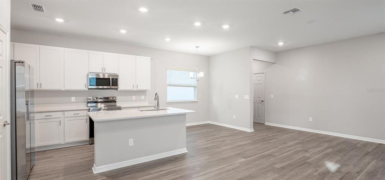 Furnished interior view inside a new home in The Crossings - Bungalows, St. Cloud (Image 5).