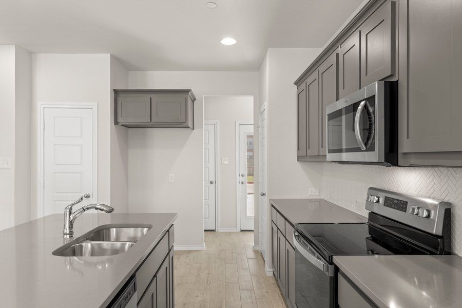 Front exterior of a new home in Sanger Circle, Sanger, TX, highlighting curb appeal (Image 12).