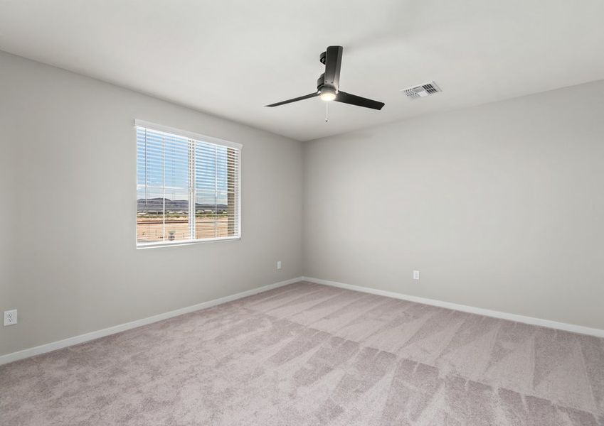 The master bedroom features a ceiling fan and ample space.
