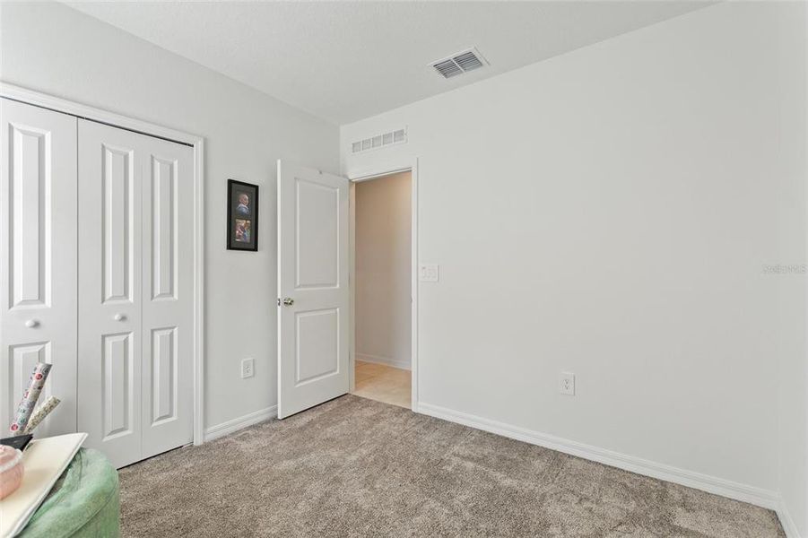 Spacious, unfurnished interior of a new home in Lawson Dunes: Estate Collection, Haines City (Image 20).